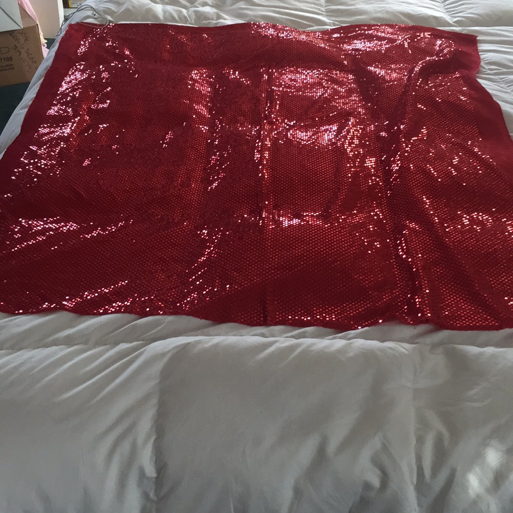 Red Sequins Material Used As Devils Cape